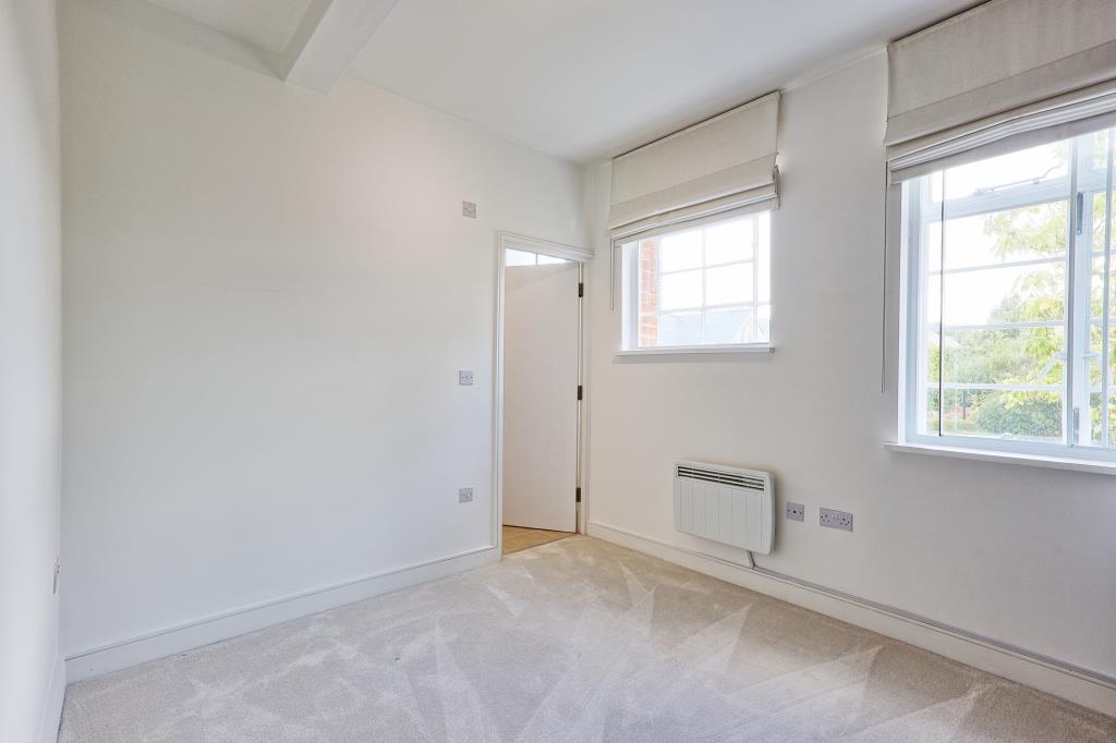 Lot: 6 - ATTRACTIVE TWO-BEDROOM APARTMENT IN CONVERTED FORMER HOSPITAL BUILDING - Alternative view of Bedroom 1 with door to en-suite